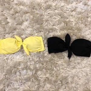Two Victoria Secret strapless bathing suit tops.